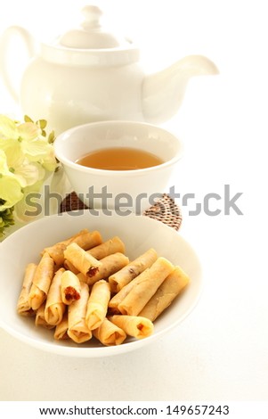 East Asian snack food, Chili prawn rolls on white dish white with Chinese tea
