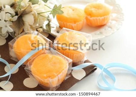 homemade orange cake packed in plactic bag for gift image