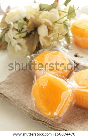 homemade orange cake packed in plactic bag for gift image