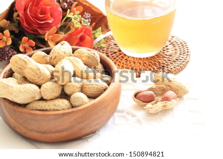 Organic roasted peanut from Japan Chiba prefecture in wooden bowl and drink
