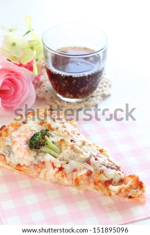 broccoli and seafood pizza with cola on background