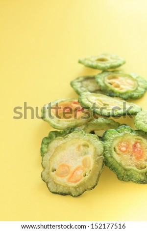 dried vegetable, sliced bitter melon on yellow  background