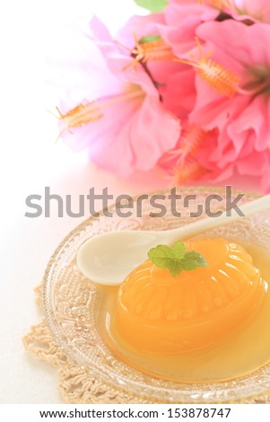 Homemade mango jelly with hibiscus on background for tropical food image