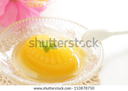 Homemade mango jelly with hibiscus on background for tropical food image
