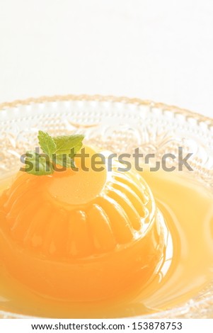 Homemade mango jelly close up on white background