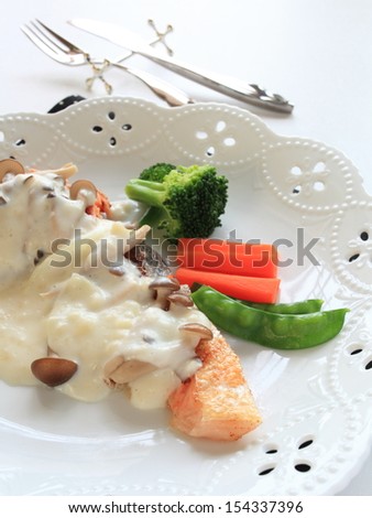 French food, sauteed salmon fish with white sauce