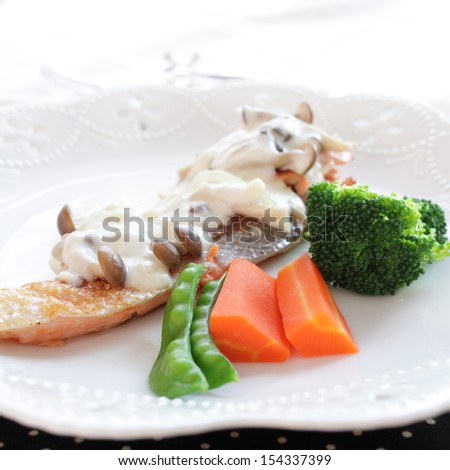 French food, sauteed salmon fish with white sauce