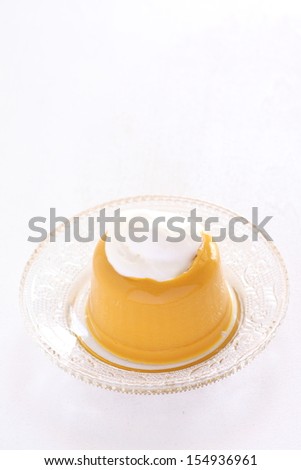 homemade pumpkin pudding with fresh cream on top