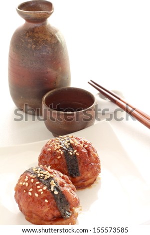 Japanese alcohol Sake and meat ball on lotus root