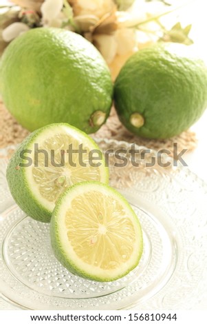 freshness green lemon cut in half on glass dish from Japan Ehime Prefecture for regional food image