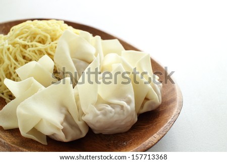 Chinese food food ingredient, Raw wonton and noodles on wooden plate