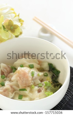 Chinese food, boiled Wonton with lettuce on bowl for gourmet dumpling image