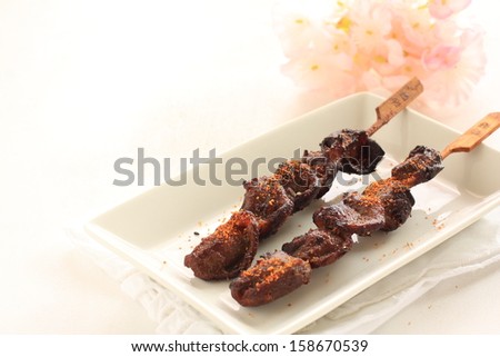 Japanese food, Gizzard Yakitori with flower on white background