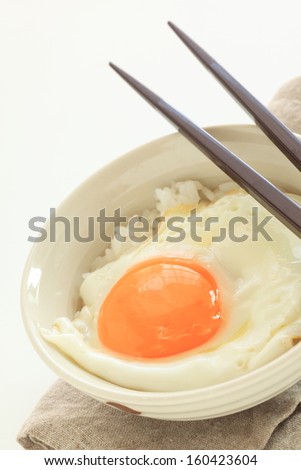 Sunny side up on steamed Japanese steamed rice for breakfast image
