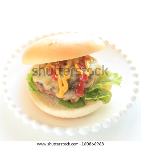 homemade gourmet Cheese burger on dish with copy space