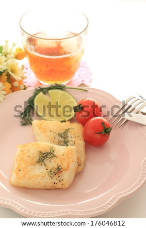 flat and dill weed sauteed with iced tea on background