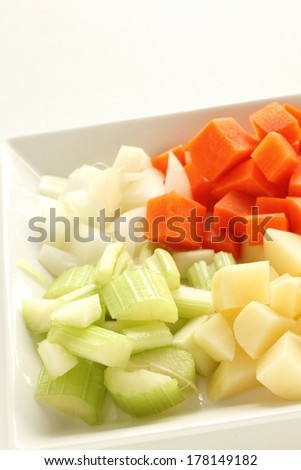 chopped celery, potato, carrot and onion for prepared food image