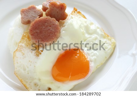Cantonese food, sunny side up fried egg and luncheon meat on rice