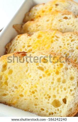 prepared baugette and egg for bread pudding cooking image