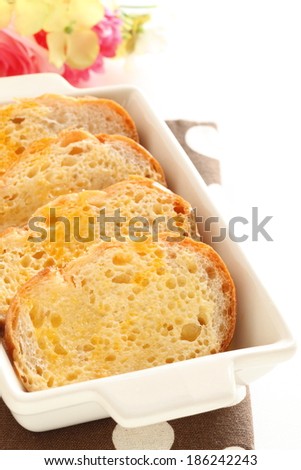 prepared baugette and egg for bread pudding cooking image