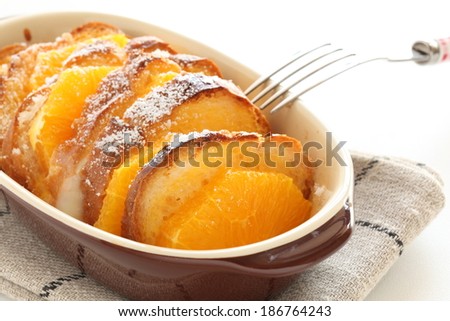 Homemade bread pudding, baked orange and bread with white background