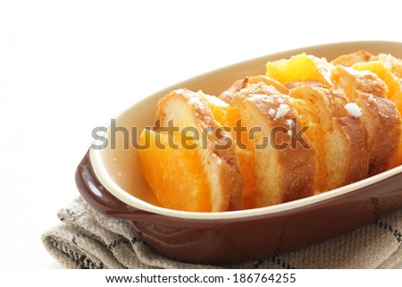 Homemade bread pudding, prepared orange and bread soaked with egg and milk