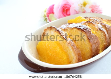 Homemade bread pudding, orange and bread with white background