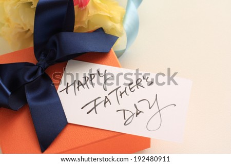 Hand writing greeting card on present for Father\'s day image