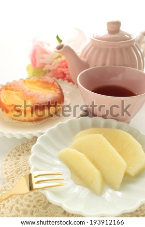 Gourmet dessert, Fuji apple with tea and cake on background for winter food image