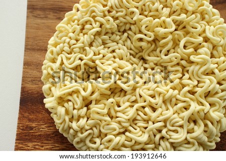 close up of Japanese instant noodles on wooden plate for emergency food image