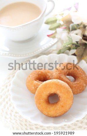 sugar donut and milk tea in diorama style