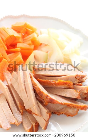 Chinese cooking, roasted pork cut in stick with vegetable ready for stir frying