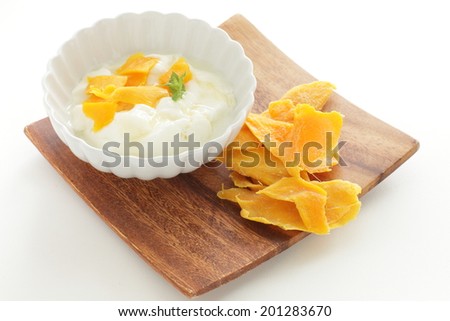 Dried mango and honey on yogurt