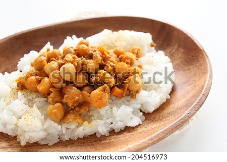 Chick pea curry and rice on wooden plate for cafe food image