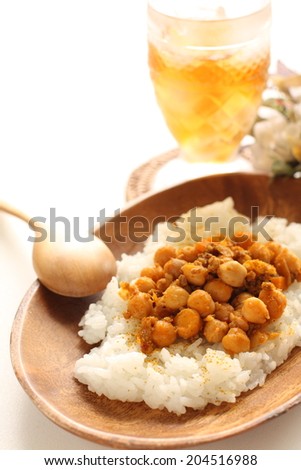 Chick pea curry and iced tea with flower on background for cafe food image