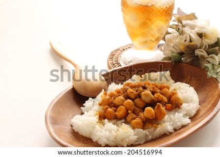 Chick pea curry and iced tea with flower on background for cafe food image