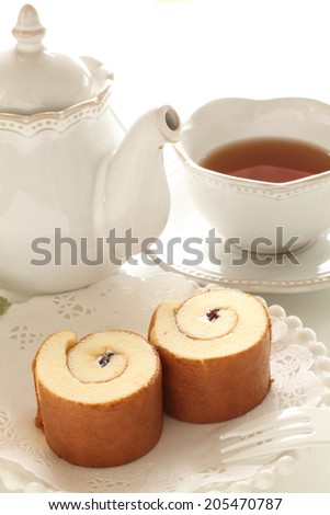 Swiss roll and tea for afternoon tea image