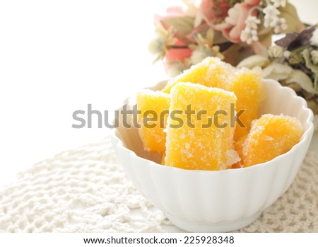 tropical food, frozen apple mango on flower background