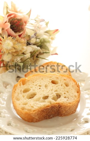 Frozen bread, baguette on dish with copy space for storage food image