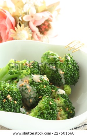 healthy food, steamed broccoli with sesame dressing