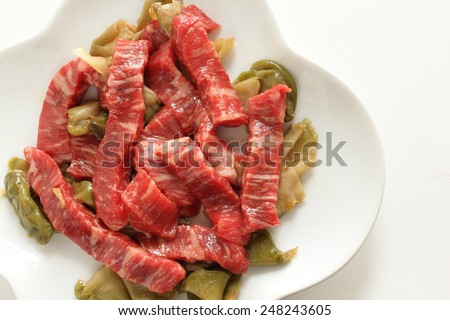 Chinese cooking, prepared marble beef and pickled vegetable on white dish ready for steaming