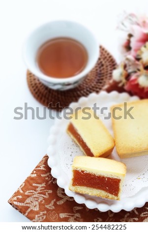 Taiwanese cuisine, pineapple cake in half section served with chinese tea
