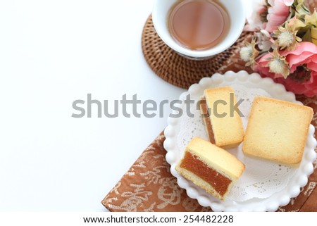 Taiwanese cuisine, pineapple cake in half section served with chinese tea