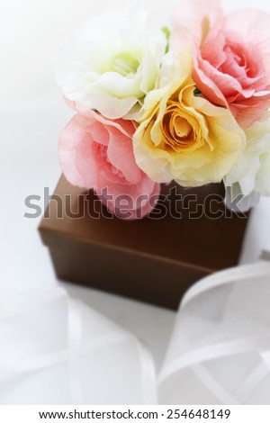 artificial flower bouquet and gift box for holiday image