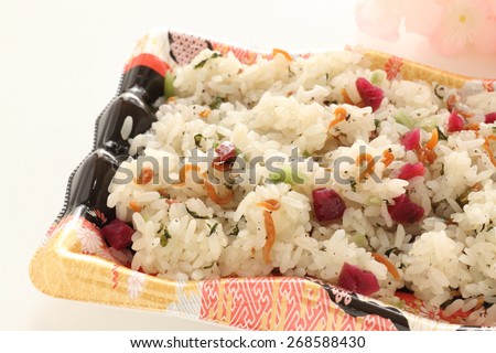 Umeboshi and small sardine sticky rice on food tray for Japanese food image