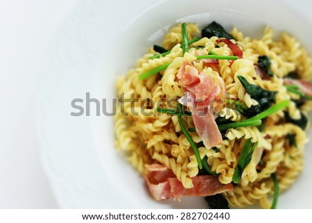 Homemade italian noodles, bacon and spinach fusilli pasta