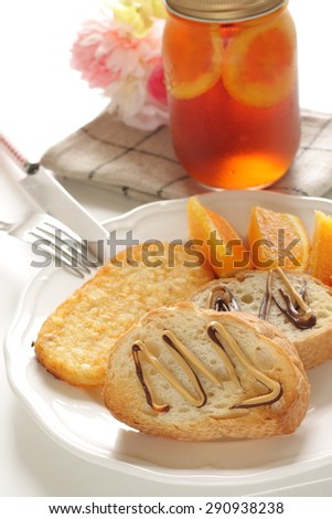 butter toast, hash brown and orange breakfast with jar tea on background for cafe food image