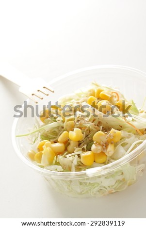 sweet corn and cabbage salad in food container for take out food image