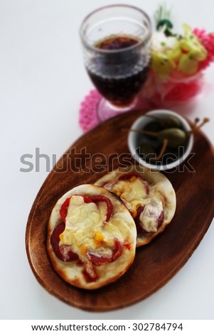homemade mini pizza with cola on background
