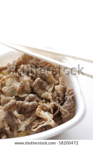 Take out Packed lunch of Sweet Soy Beef Fillet with  on Rice with chopsticks